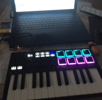 Portable 25-Key MIDI Keyboard Controller with Wireless Function & RGB Pads for Music Creation
